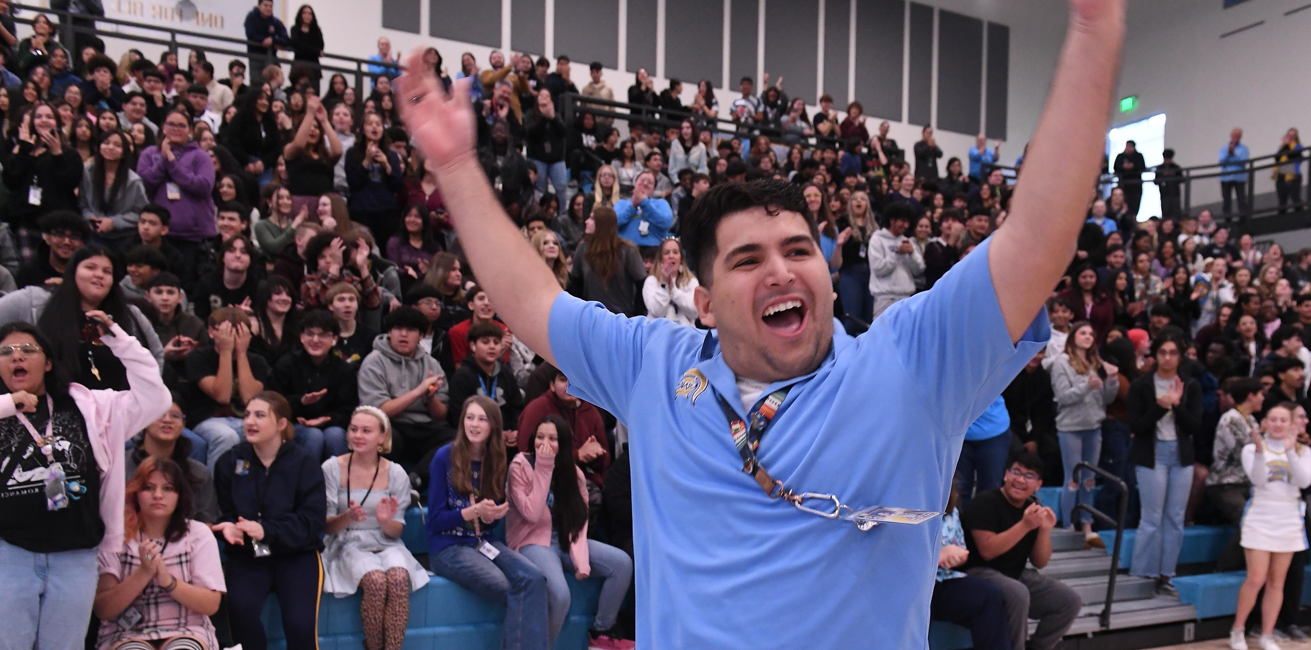 Caleb Flores throwing his hands up in celebration